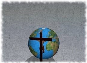 The cross is facing the huge globe.