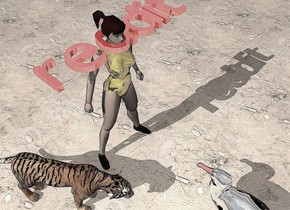 the shiny red "reddit" is in the gold woman. it is face up. the ground is dirt. the silver albatross is a few feet in front of the woman. it is facing the woman. it is cloudy. the tiger is to the left of the woman. it is facing the albatross.
