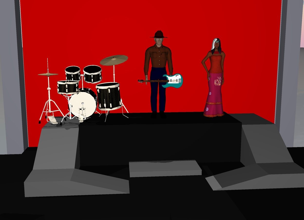Input text: man is on big stage.

lady is 2 feet to the right of the man.

drum kit is 1 feet to the left of the man.

guitar is 6 inches in front of man and 8 foot off the ground.

