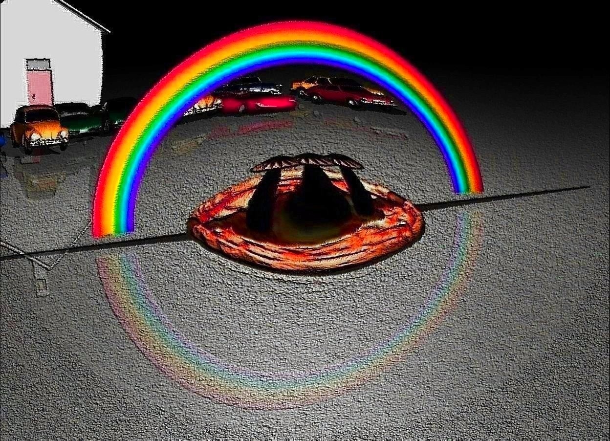 Input text: tiny rainbow over giant pizza behind 3 enormous rainbow mushrooms.

12 cars far behind rainbow.

it is night.

the white light is 1 feet above the rainbow.

asphalt ground.

school behind cars.