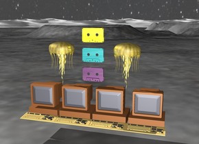 there is 4 computers 1 foot above the ground. there is a  large shiny purple cassette 3 inch above the computers. there is a large shiny teal cassette 3 inch above the purple cassette. there is a large shiny yellow cassette 3 inch above the teal cassette.  there is a big gold invertebrate  5 inches to the right and below the yellow cassette. there is a big gold jellyfish  5 inches to the left and below the yellow cassette.


the sky is dark [stars]