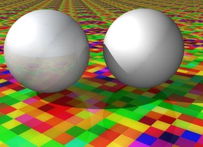 The dull sphere is two inches to the left of the unreflective sphere. the ground is [texture]. the camera light is grey.