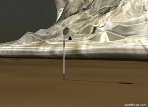 A 20 feet tall golden wave. A dental mirror is in front of the wave. Lights are black. The sky is dark. A blue drop is 4.5 inches above the ground on right side of the mirror.