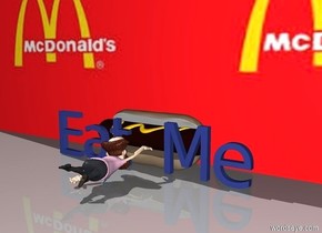 There is a giant hotdog.

In front of the hotdog is a Sea Blue "Eat Me".

In front of "Eat Me" is a small man facing North.

Behind the hotdog is a [Maccas] wall.

