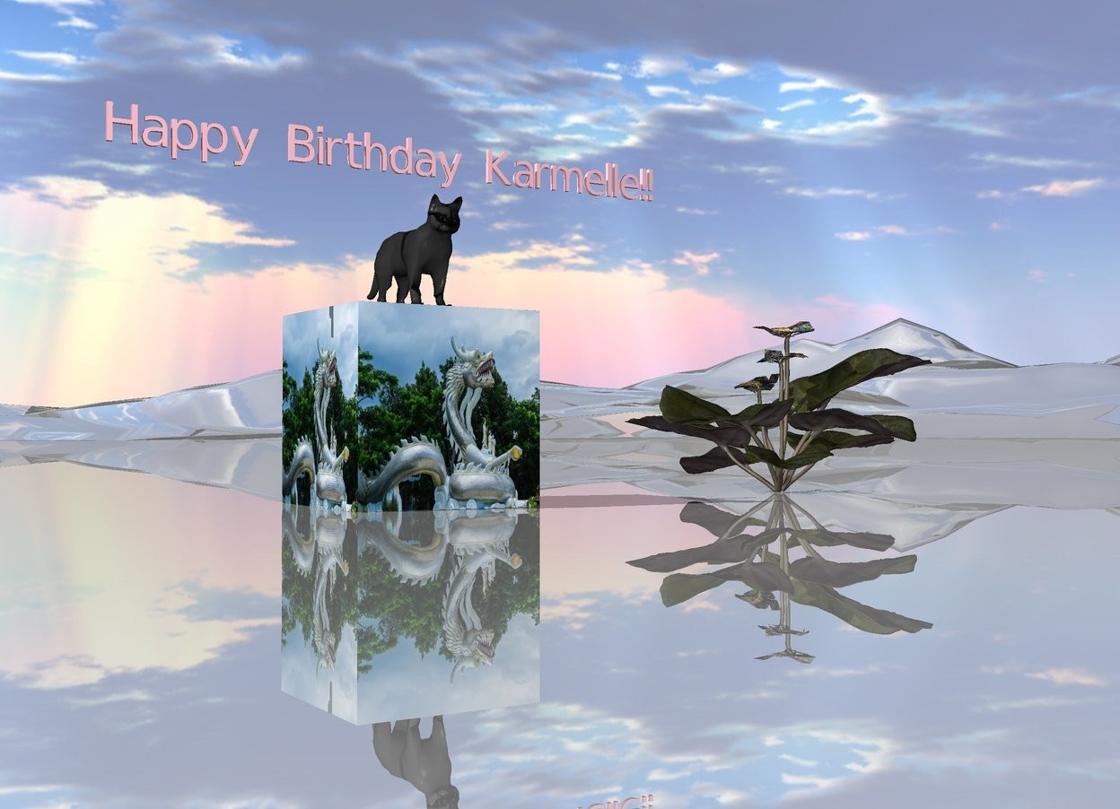 Input text: The large [paint] cube is on the shiny mountain range.
The cat is on the cube.
The very small pink "Happy Birthday Karmelle!!" is a few inches above the cat.
A very large van gogh flower is a couple feet to the right of the cube.