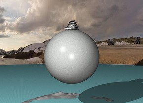 the stone sphere  is one hundred feet above the huge sea. the sphere is 200 feet wide.

a castle is on the sphere. the castle is facing left.