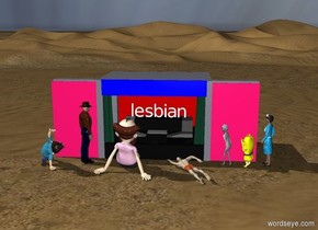 there is a stage.
there is a lesbian on the stage.
there are seven people in front of the stage.
the people are facing the stage.