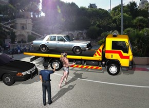 The car is on the wrecker. The racetrack backdrop. The man is 4 feet to the left of the wrecker. The man is facing southeast. A police car is 3 feet behind the man. a police officer is 3 feet to the left of the man. The police officer is facing the man.